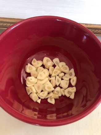 A red bowl with food in it Description automatically generated with medium confidence